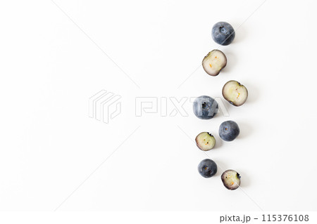Ripe organic blueberries on white wooden table background. Selective focus. Ripe organic blueberries on white wooden table background. Selective focus. 115376108