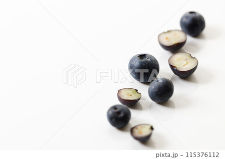 Ripe organic blueberries on white wooden table background. Selective focus. 115376112