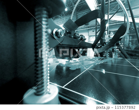 3D printer printing a model. Equipment of a 3D printer during the process of printing a model from molten plastic 3D printer printing a model. Equipment of a 3D printer during the process of printing a model from molten plastic 115377892