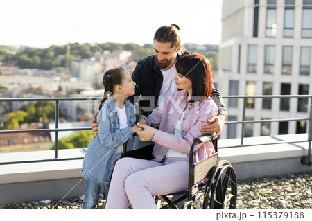 Dad and daughter support mom in treatment of serious injury. 115379188
