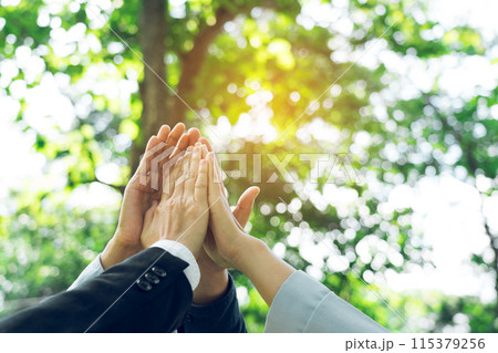 Group of volunteer people joining for cooperation about global community teamwork with join hand together, World environment day, sustainable development goal. 115379256