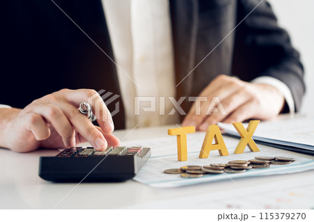 Businessman's hands calculating numbers at a calculator.Tax deduction planning concept. Businessman's hands calculating numbers at a calculator.Tax deduction planning concept. 115379270