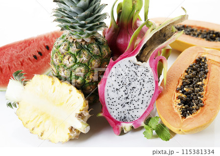 Creative layout made of fruits. Watermelon, pineapple, dragon fruit and papaya on white background. Creative layout made of fruits. Watermelon, pineapple, dragon fruit and papaya on white background. 115381334