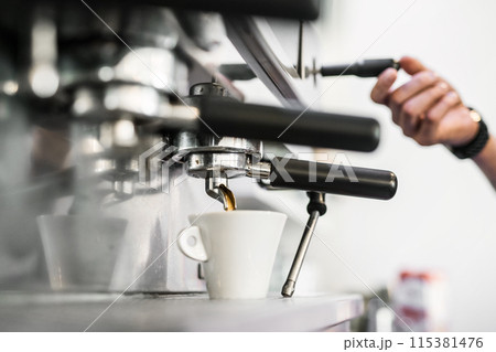 Espresso machine pouring fresh black coffee, close up. Espresso machine pouring fresh black coffee, close up. 115381476