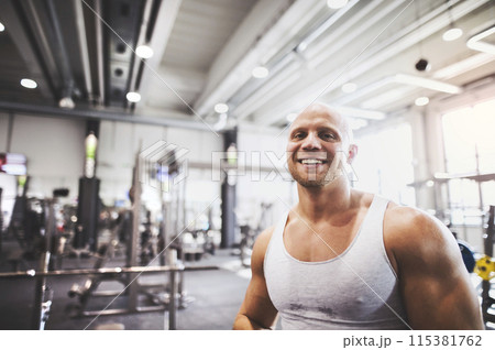 Strong man exercising in gym. Routine workout for physical and mental health. 115381762