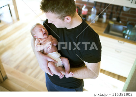 Father holding his newborn baby. Unconditional paternal love, Father's Day concept. Father holding his newborn baby. Unconditional paternal love, Father's Day concept. 115381902