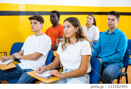 Group of people studying in school for taxi drivers 115382405