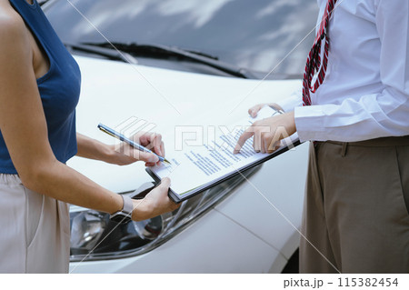 Insurance concept, insurance agent checking broken car and submit a claim form after an accident traffic accident. Insurance concept, insurance agent checking broken car and submit a claim form after an accident traffic accident. 115382454