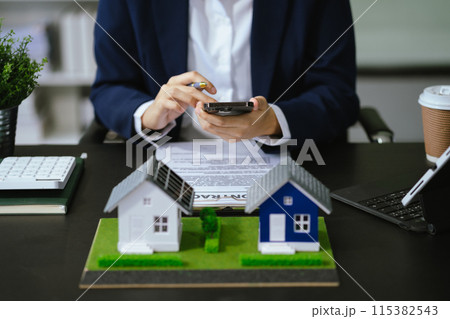 Home Insurance and Real estate investment concept, new client after signing agreement contract with approved property application form. 115382543