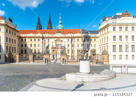 The statue of Tomas Garrigue Masaryk stands before the historical gate of Prague Castle under a clear blue sky. Hradcany Square, Prague, Czechia The statue of Tomas Garrigue Masaryk stands before the historical gate of Prague Castle under a clear blue sky. Hradcany Square, Prague, Czechia 115384327