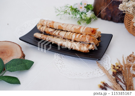 Delicious Tiramisu Banana Roll as a Background Delicious Tiramisu Banana Roll as a Background 115385167