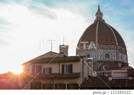 The Florence Cathedral, Santa Maria del Fiore in sunset light. Architecture and landmark of Florence. Travel background. The Florence Cathedral, Santa Maria del Fiore in sunset light. Architecture and landmark of Florence. Travel background. 115385522