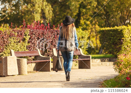 Back view of stylish woman on air Back view of stylish woman on air 115386024