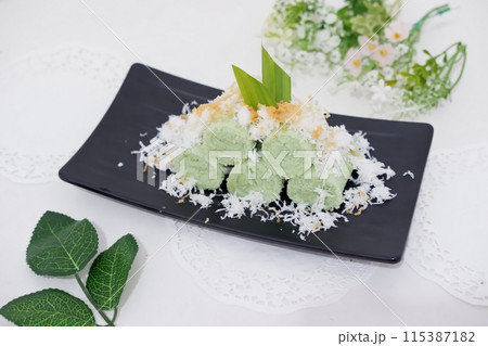 Pandan cake with grated coconut as a background Pandan cake with grated coconut as a background 115387182