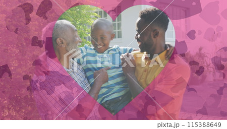 Image of hearts over happy african american three generation men family in garden 115388649