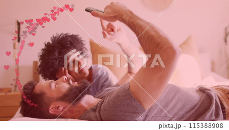 Image of hearts ove diverse couple using smartphone Image of hearts ove diverse couple using smartphone 115388908