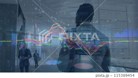 Image of financial graphs over back view of african american businessman walking in office Image of financial graphs over back view of african american businessman walking in office 115389454