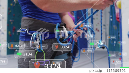 Image of media icons over caucasian woman on climbing wall 115389591