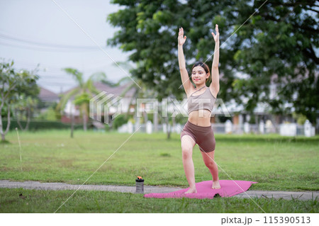 Young Woman Practice Yoga in Park. Healthy Lifestyle, Outdoor Fitness, Stretching, and Mindfulness in Nature Young Woman Practice Yoga in Park. Healthy Lifestyle, Outdoor Fitness, Stretching, and Mindfulness in Nature 115390513