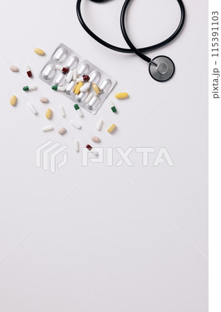 stethoscope and scattered pills stethoscope and scattered pills 115391103