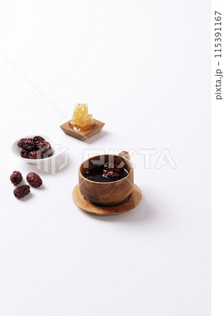 traditional jujube tea in wooden teacups 115391167