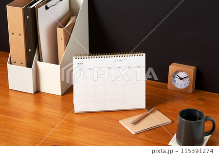 the bookshelves and tabletop achievements on the wooden desk the bookshelves and tabletop achievements on the wooden desk 115391274