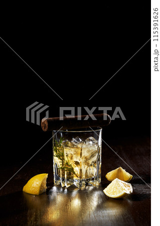 the composition of a glass of lemon wine and a cigar the composition of a glass of lemon wine and a cigar 115391626