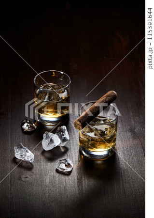 an ice cup and a cigar 115391644