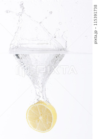 half of a lemon falling into the water half of a lemon falling into the water 115391738