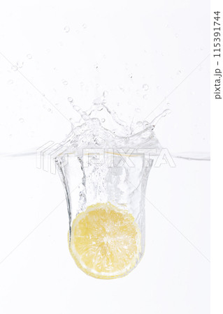 half of a lemon falling into the water half of a lemon falling into the water 115391744