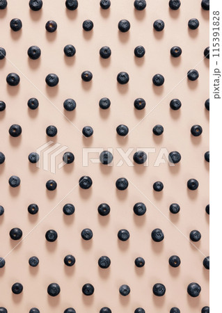 a regular arrangement of blueberries 115391828