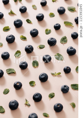 regular blueberries and green leaves 115391845