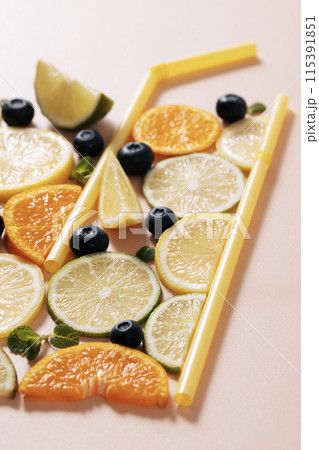 Citrus fruit cross section and straw Citrus fruit cross section and straw 115391851