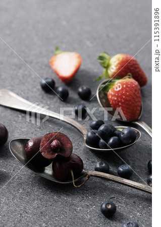 berries filled with spoons berries filled with spoons 115391896