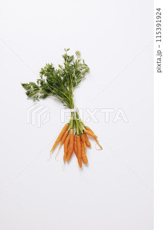 a mini carrot on a white background 115391924