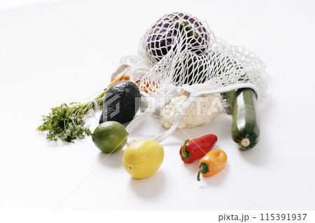 various kinds of fruits and vegetables that come out of the net bag 115391937
