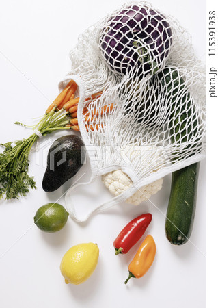 various kinds of fruits and vegetables that come out of the net bag 115391938