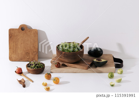 green vegetables filled with winemock chopping boards and wood bowls 115391991