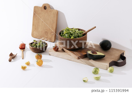 green vegetables filled with winemock chopping boards and wood bowls green vegetables filled with winemock chopping boards and wood bowls 115391994