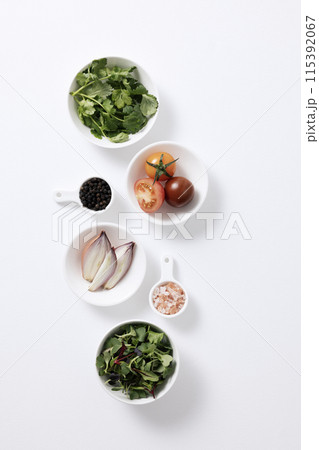 the composition of salad ingredients on a white plate the composition of salad ingredients on a white plate 115392067