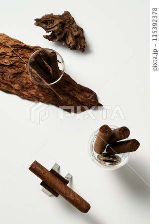 matches and cigars in a glass cup matches and cigars in a glass cup 115392378