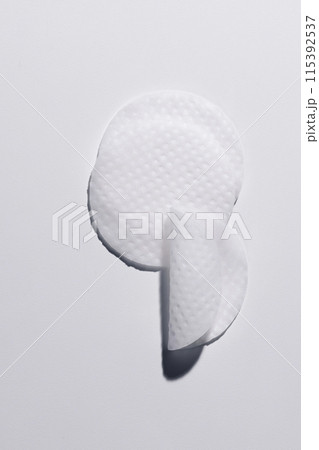 Some circular toner pads on a white background 115392537
