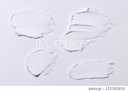 It's a soft white cosmetic cream on a white background 115392658