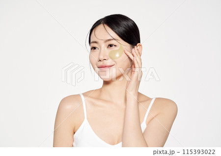 an Asian woman with eye patches on her face an Asian woman with eye patches on her face 115393022