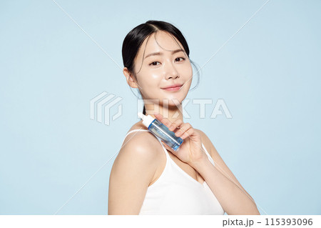 Asian woman posing with eye patches on both cheeks 115393096