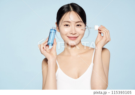 Asian woman posing with eye patches on both cheeks Asian woman posing with eye patches on both cheeks 115393105