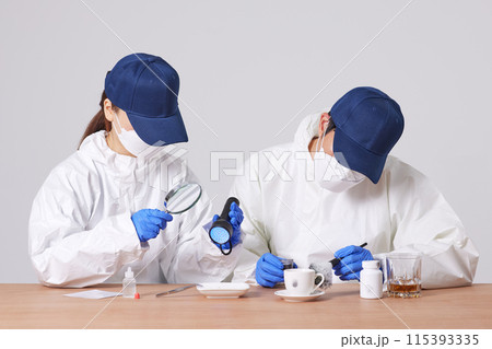 Researchers from the CSI Scientific Investigation Unit identifying evidence and collecting fingerprints at crime and incident sites Researchers from the CSI Scientific Investigation Unit identifying evidence and collecting fingerprints at crime and incident sites 115393335