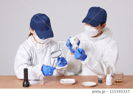 Researchers from the CSI Scientific Investigation Unit identifying evidence and collecting fingerprints at crime and incident sites Researchers from the CSI Scientific Investigation Unit identifying evidence and collecting fingerprints at crime and incident sites 115393337