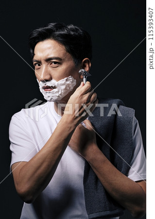 a middle aged man about to start shaving a middle aged man about to start shaving 115393407