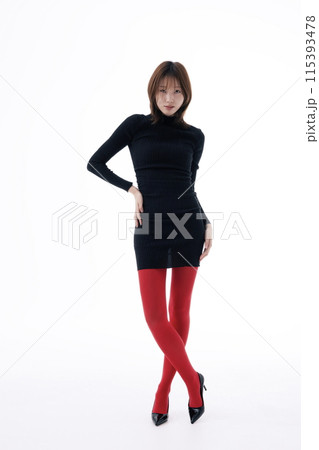 Korean Woman Poses in Black Dress and Red Leggings Korean Woman Poses in Black Dress and Red Leggings 115393478